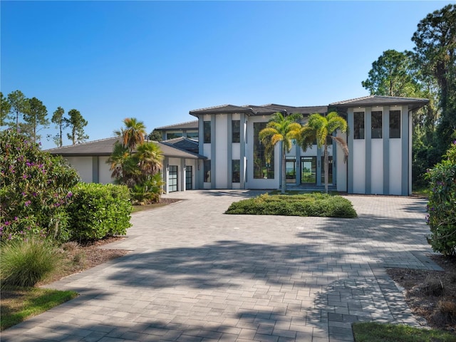 view of front of property with french doors and a garage