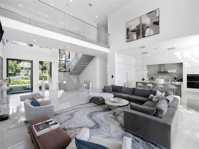 living room featuring a high ceiling