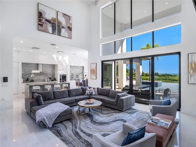 living room featuring a towering ceiling