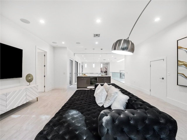 interior space featuring beverage cooler and light colored carpet