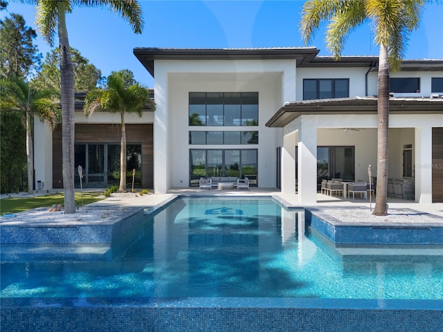 rear view of property with a patio area