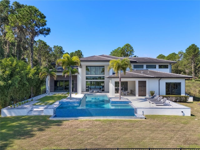 view of pool featuring a yard and a patio