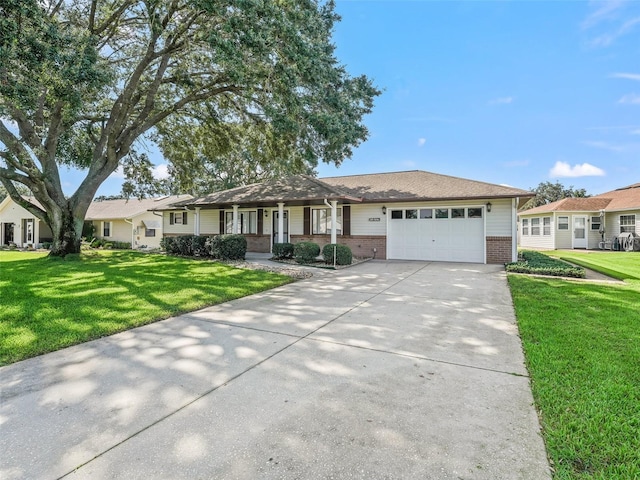 single story home featuring a garage and a front yard