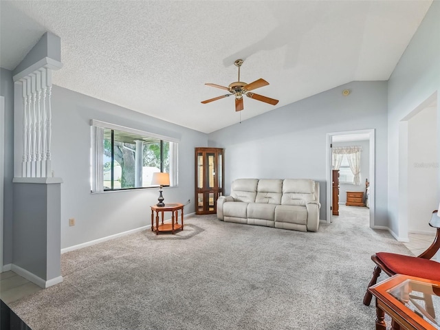 living room with ceiling fan, light colored carpet, a textured ceiling, and lofted ceiling