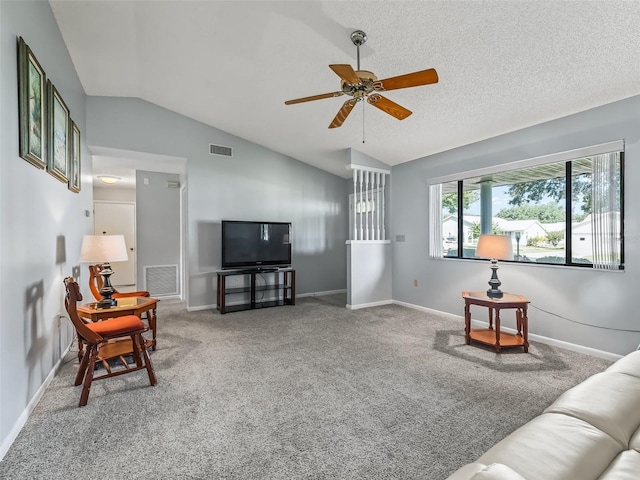 living room with ceiling fan, a textured ceiling, vaulted ceiling, and carpet