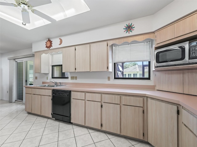 kitchen with stainless steel microwave, dishwasher, light brown cabinets, ceiling fan, and sink