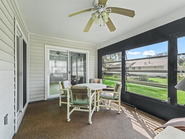 sunroom / solarium featuring ceiling fan