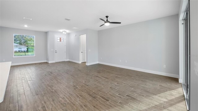 unfurnished room with ceiling fan and light hardwood / wood-style floors