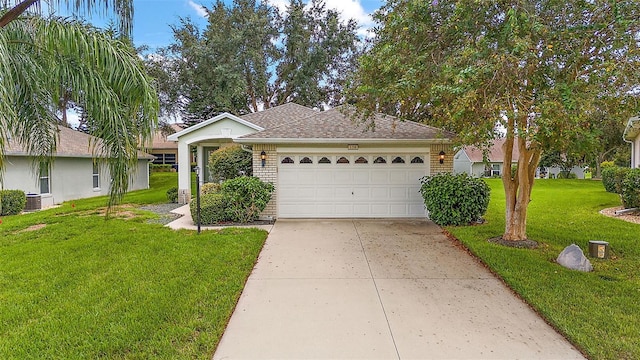 ranch-style home with a front yard and a garage