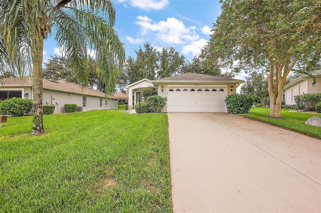 ranch-style home with a front yard and a garage