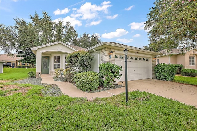 ranch-style home with a garage, driveway, and a front lawn