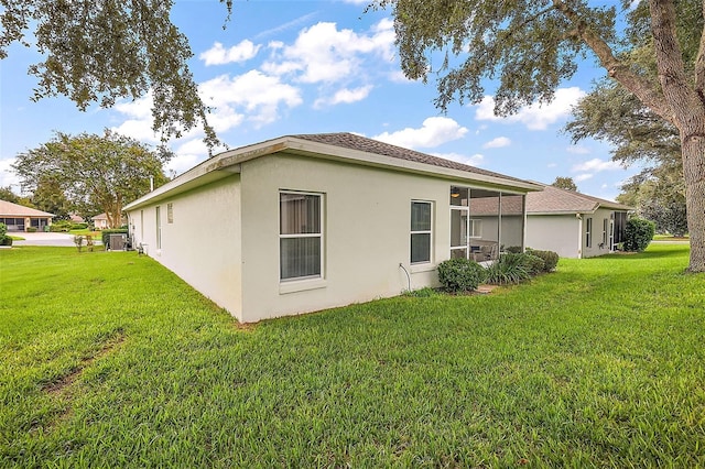 back of property featuring a lawn