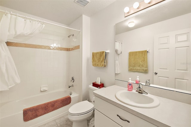 full bathroom with shower / bath combination with curtain, a textured ceiling, tile patterned floors, vanity, and toilet