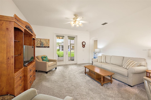 carpeted living room featuring ceiling fan