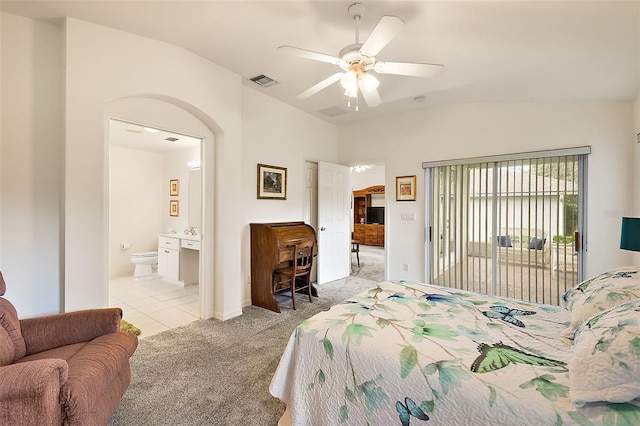 carpeted bedroom featuring connected bathroom, lofted ceiling, ceiling fan, and access to exterior