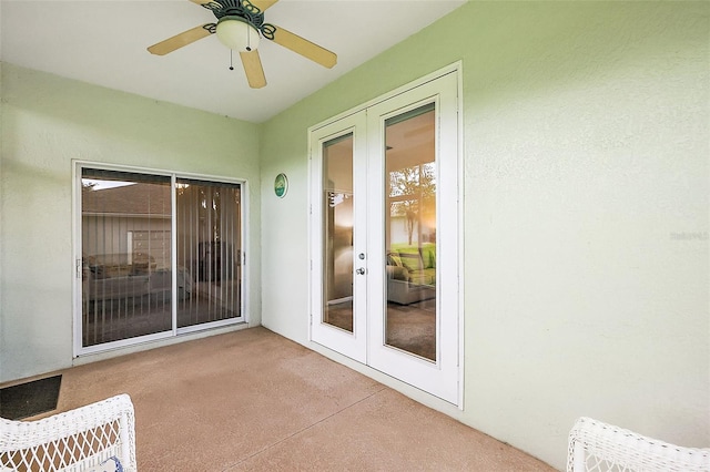 sunroom / solarium featuring ceiling fan and french doors