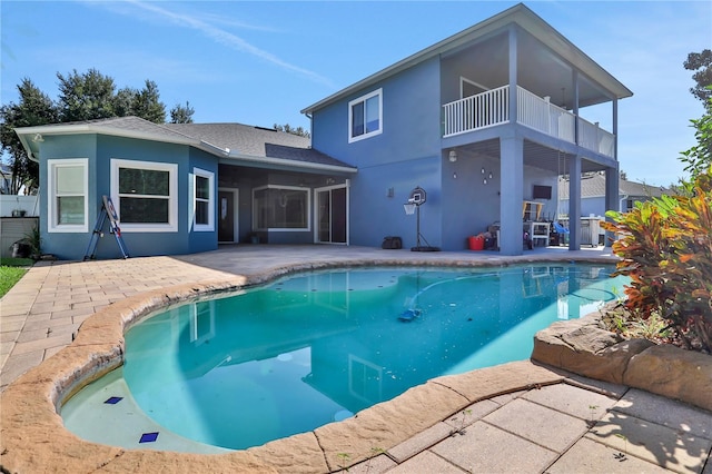 view of swimming pool with a patio area