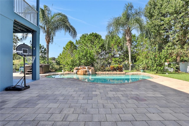 view of pool featuring a patio and a hot tub