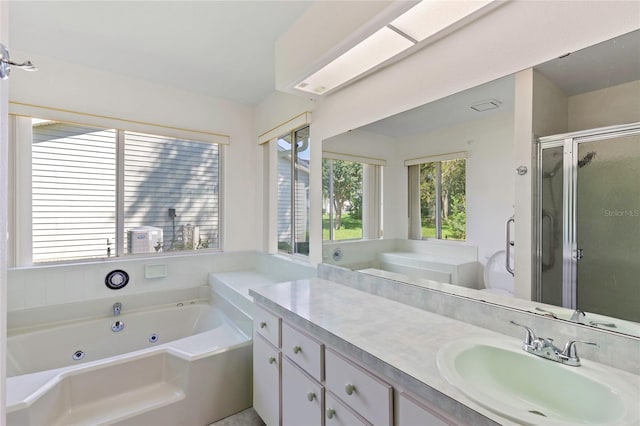 bathroom featuring plus walk in shower and vanity