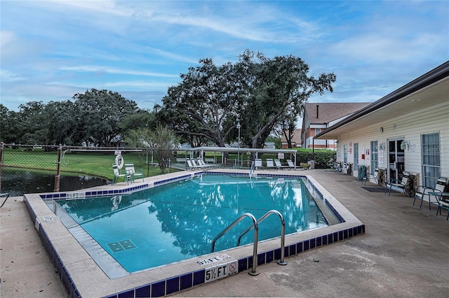 view of swimming pool with a patio area