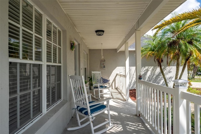 wooden terrace with a porch