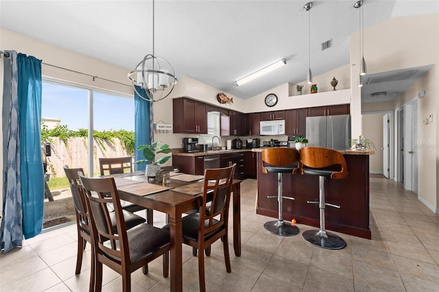 tiled dining room with an inviting chandelier, sink, and high vaulted ceiling