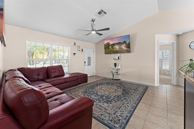 tiled living room featuring lofted ceiling and ceiling fan