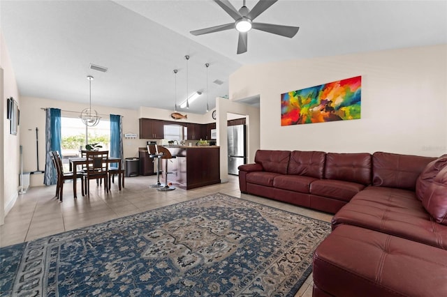 tiled living room with lofted ceiling and ceiling fan