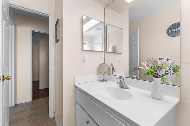 bathroom with vanity and tile patterned floors