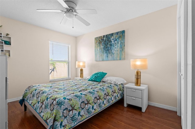 bedroom featuring ceiling fan and dark wood-type flooring