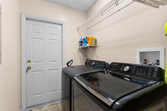 clothes washing area featuring independent washer and dryer