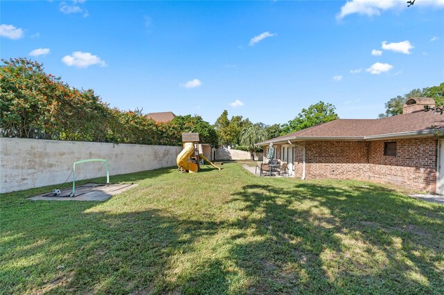 view of yard featuring a playground