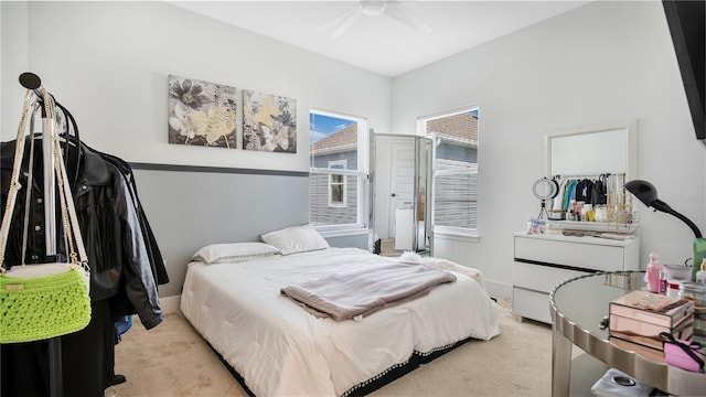 carpeted bedroom featuring ceiling fan