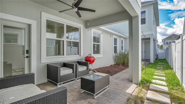 view of patio / terrace featuring an outdoor living space and ceiling fan