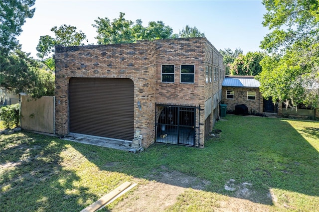 garage featuring a yard