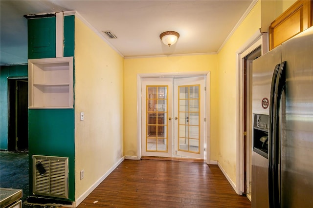 kitchen with stainless steel fridge, ornamental molding, dark wood-type flooring, and french doors