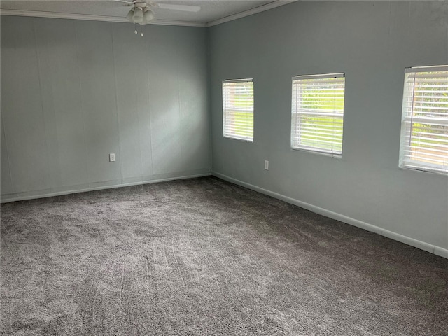 carpeted empty room with ornamental molding and ceiling fan