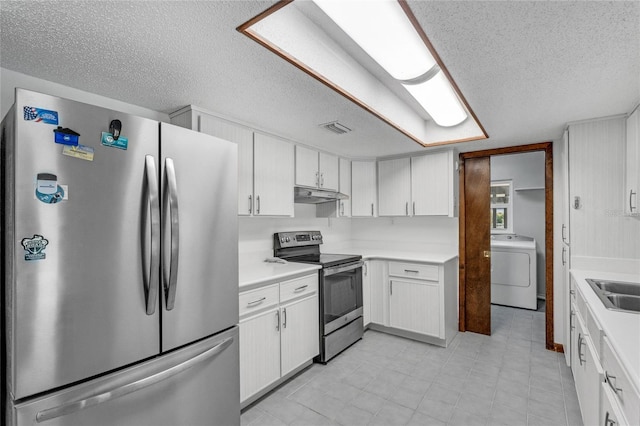 kitchen featuring washer / clothes dryer, white cabinetry, stainless steel appliances, a textured ceiling, and sink