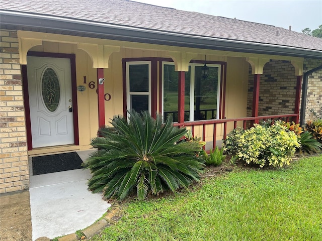 doorway to property with a porch