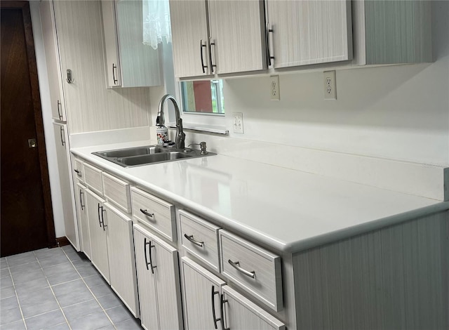 kitchen with sink and light tile patterned floors