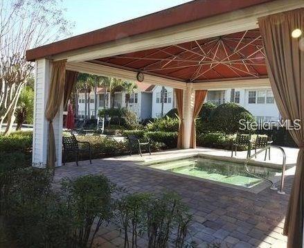 view of swimming pool featuring a gazebo and a patio area