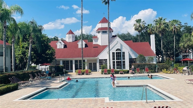 view of swimming pool with a patio area