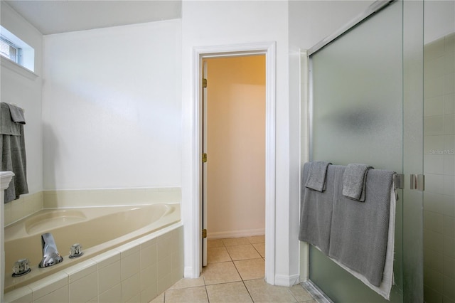 bathroom featuring separate shower and tub and tile patterned floors