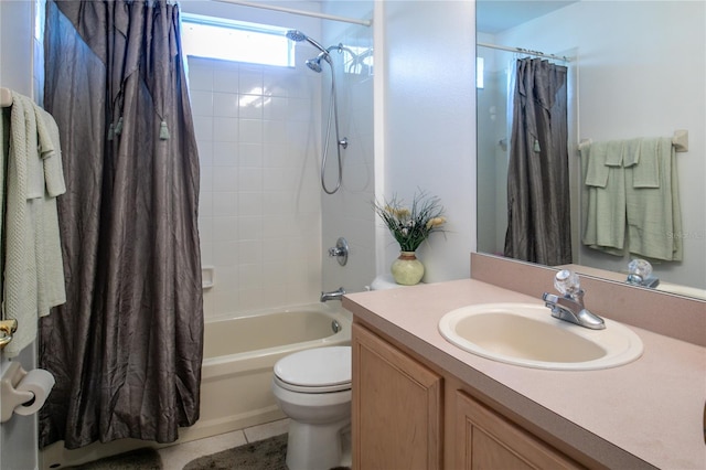 full bathroom featuring tile patterned flooring, vanity, toilet, and shower / bath combination with curtain