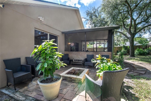 view of patio / terrace featuring an outdoor living space with a fire pit