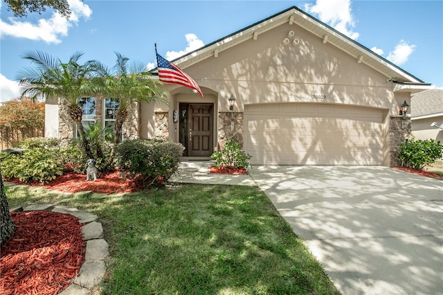 view of front of home featuring a garage and a front lawn