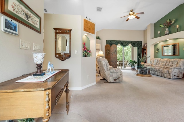 living room with vaulted ceiling, light carpet, and ceiling fan