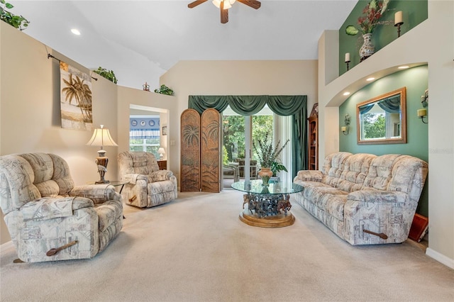 living room with ceiling fan, carpet, and high vaulted ceiling