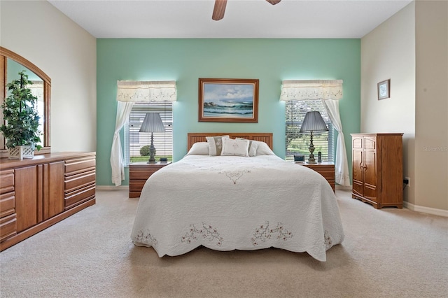 bedroom with light carpet and ceiling fan