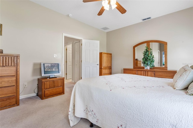 carpeted bedroom featuring ceiling fan and vaulted ceiling